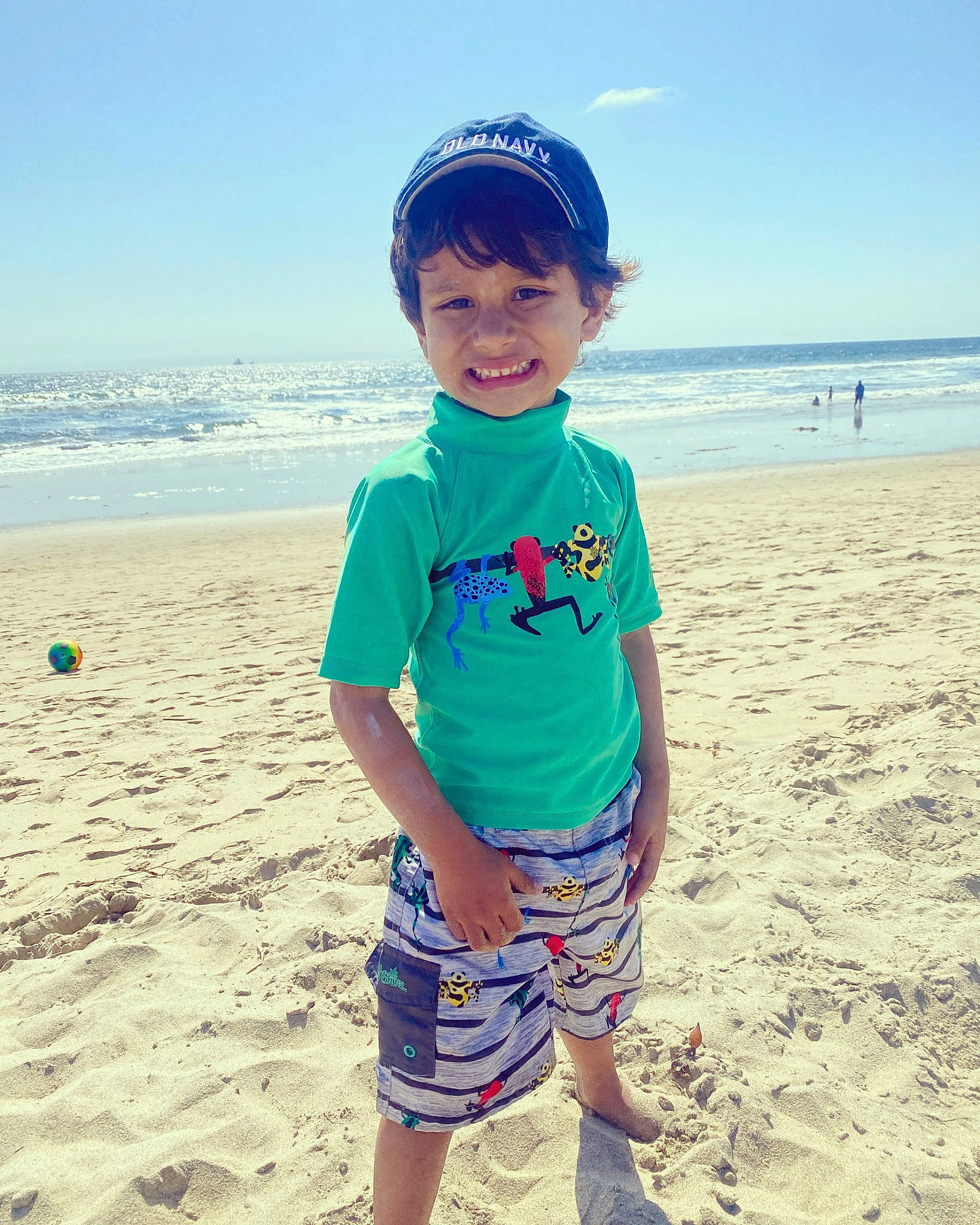 Martín is registered to the contest to win money with this photo: aqua, beach, cloud, cool, happy, holiday, horizon, joy, leisure, people_in_nature, people_on_beach, person, sand, shorts, sky, sleeve, summer, t_shirt, toddler, travel