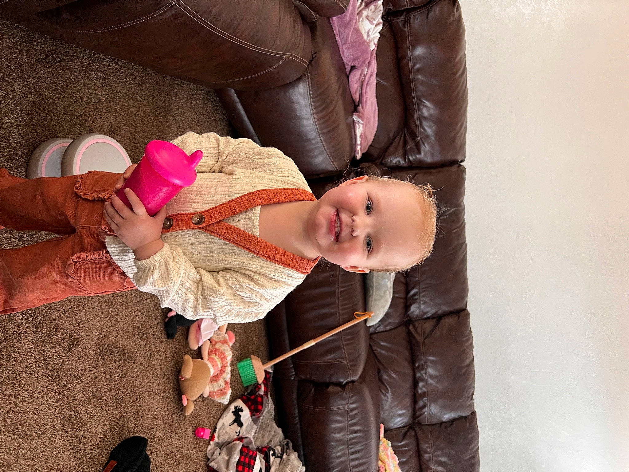 Adelynn is registered to the contest to win money with this photo: baby, child, comfort, event, fashion_design, fun, hand, happy, hat, human_body, joy, magenta, peach, person, pink, sitting, skin, sleeve, smile, textile