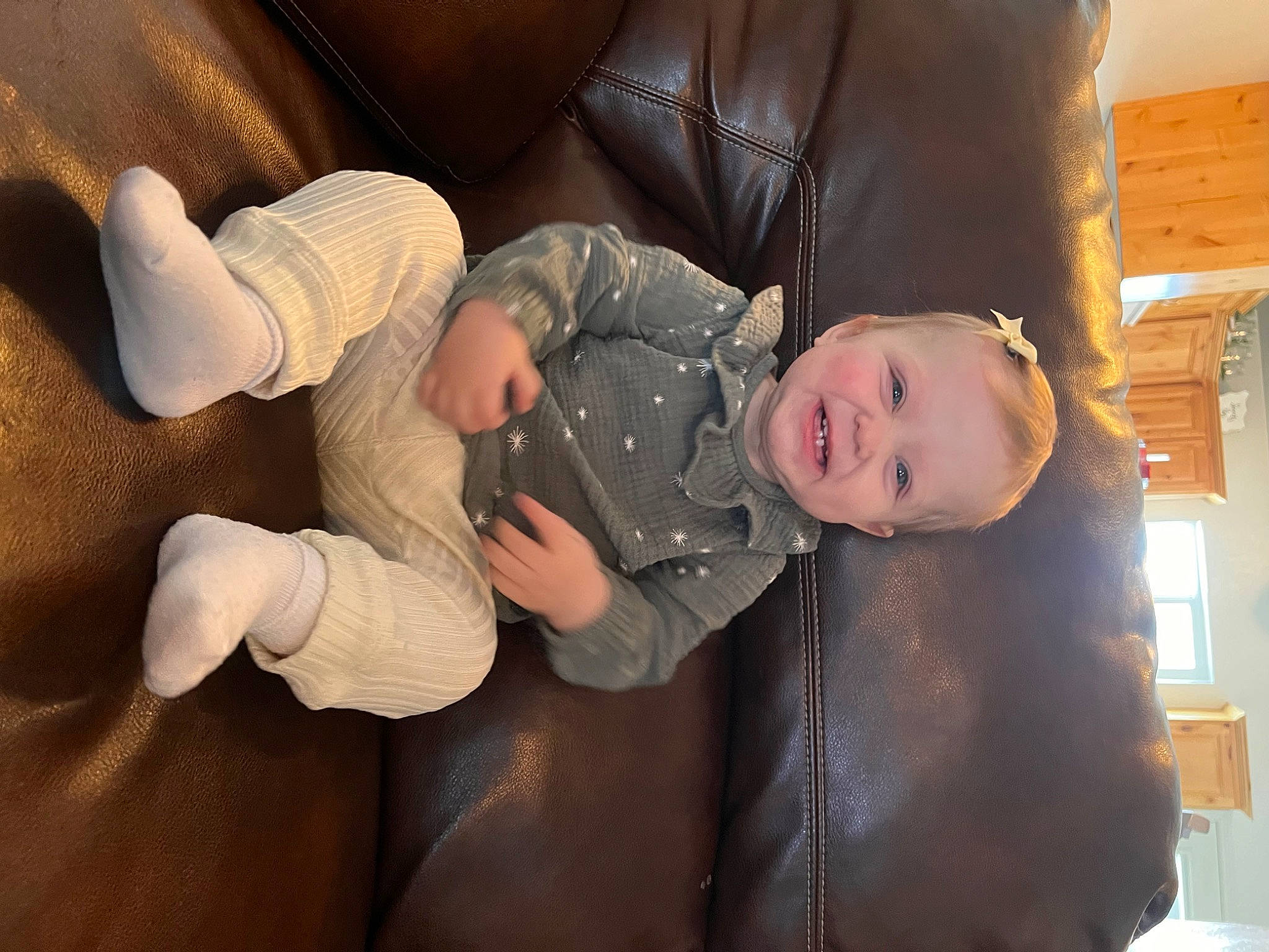 Hadley joined the competition — help win amazing prizes! baby, baby_toddler_clothing, child, comfort, flooring, foot, fun, gesture, human_body, human_leg, knee, lap, person, sitting, sleep, sleeve, smile, thigh, thumb, toddler
