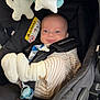 baby, smiling, stroller, pajamas, socks, pacifier, plush_toy, car_seat, child, infant, straps, seatbelt, comfort, cute, indoor, fabric, toy, baby_clothing, face, head
