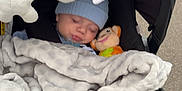 Mateo joined the competition — help win amazing prizes! baby, blanket, blue_hat, car_seat, child, cozy, face, infant, monkey_toy, plush_toy, sleeping, soft_toy, stroller, toy, young_child, wrapped, outdoor, comfort, nap, cute