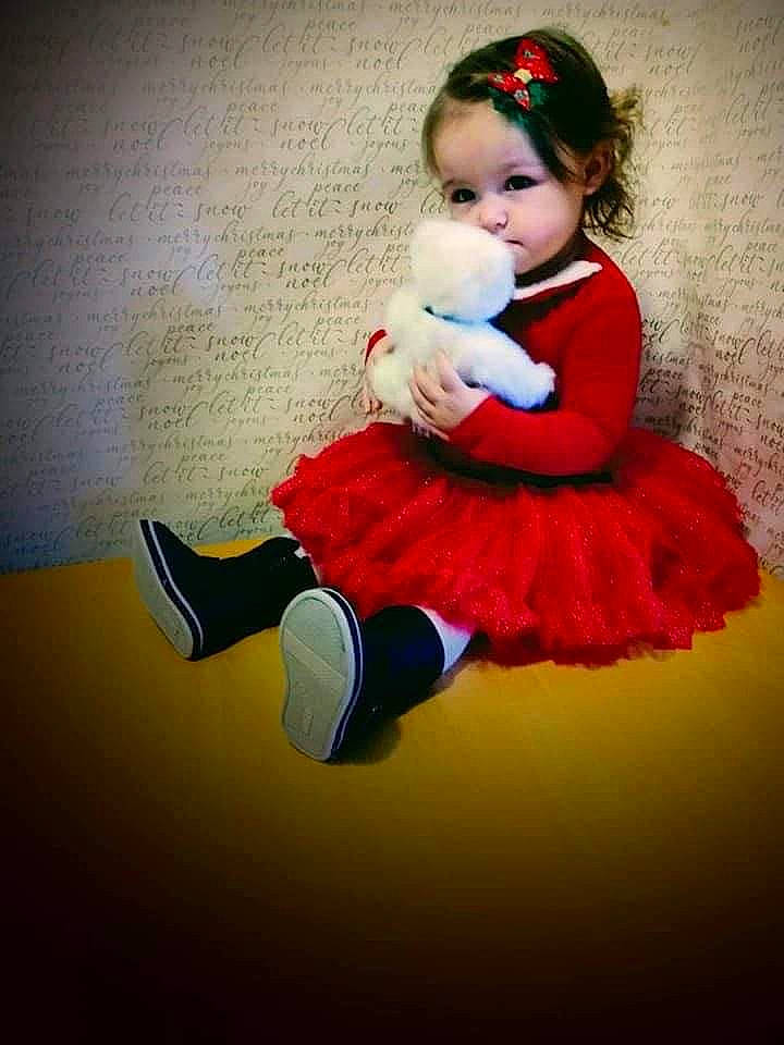 Ellie joined the competition — help win amazing prizes! baby, baby_toddler_clothing, child, costume, event, flash_photography, flooring, fun, fur, hairstyle, happy, human_leg, knee, magenta, person, sandal, shoe, sitting, sportswear, thigh