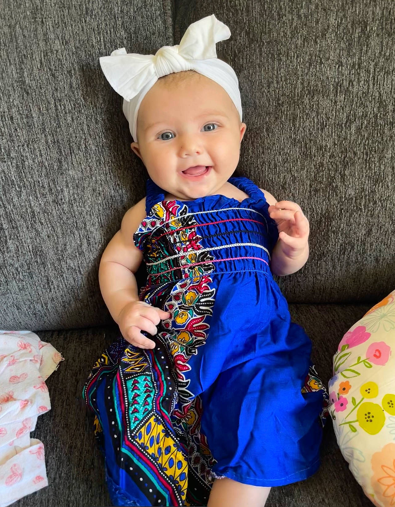 Karter joined the competition — help win amazing prizes! aqua, arm, baby, baby_toddler_clothing, day_dress, dress, face, finger, happy, headgear, human_body, one_piece_garment, pattern, person, pink, purple, skin, sleeve, smile, textile