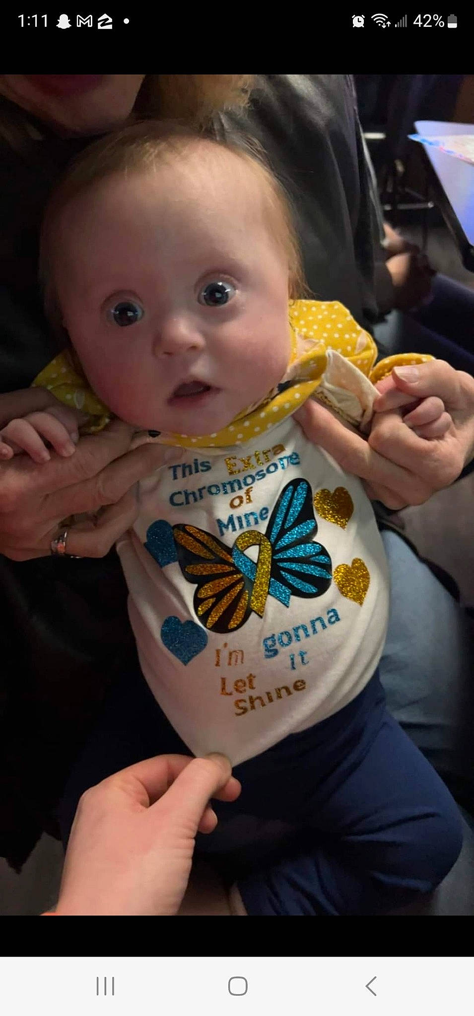 Ryleigh joined the competition — help win amazing prizes! arthropod, baby, baby_toddler_clothing, butterfly, cool, eye, face, finger, gesture, hand, happy, head, human_body, insect, iris, moths_and_butterflies, person, pollinator, skin, surprise