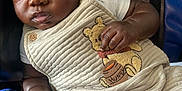 Robert joined the competition — help win amazing prizes! baby, black, blue, child, clothing, cozy, cute, expression, face, furniture, hand, indoors, infant, looking_away, onesie, person, portrait, seated, winnie_the_pooh, young