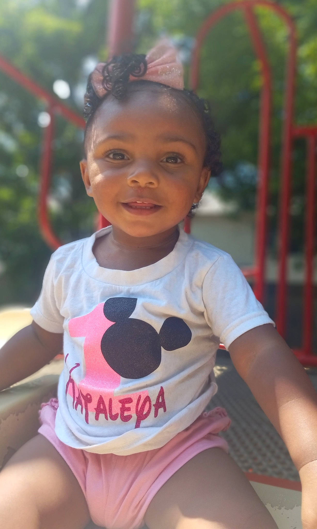 Kataleya is registered to the contest to win money with this photo: black, child, eye, facial_expression, fun, grass, happy, head, human_settlement, joy, leisure, neck, person, pink, recreation, shorts, skin, smile, summer, thigh