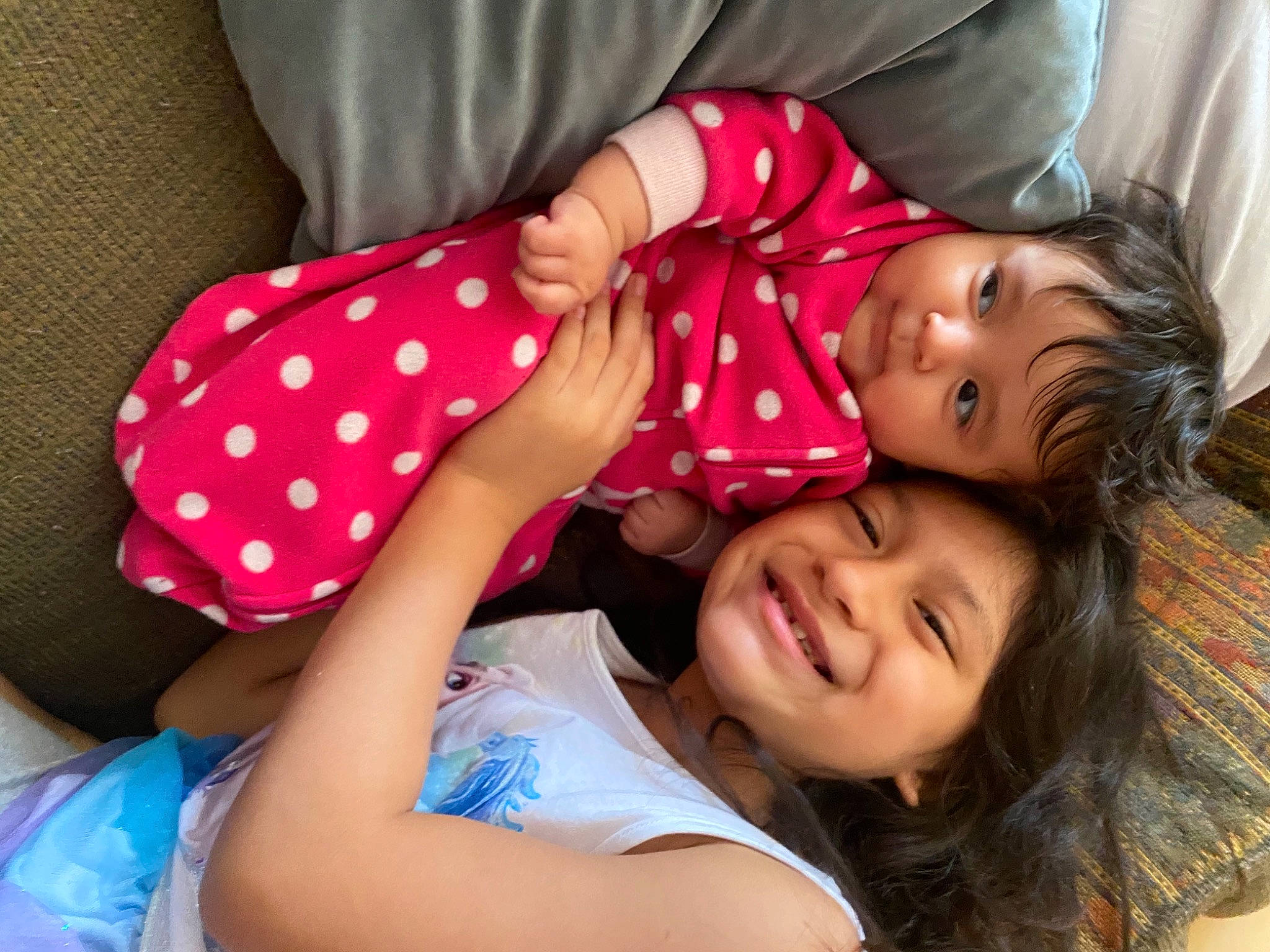 Elisa is registered to the contest to win money with this photo: arm, baby_toddler_clothing, child, comfort, face, finger, fun, gesture, hand, happy, joy, mammal, mouth, nail, person, pink, skin, sleeve, smile, summer