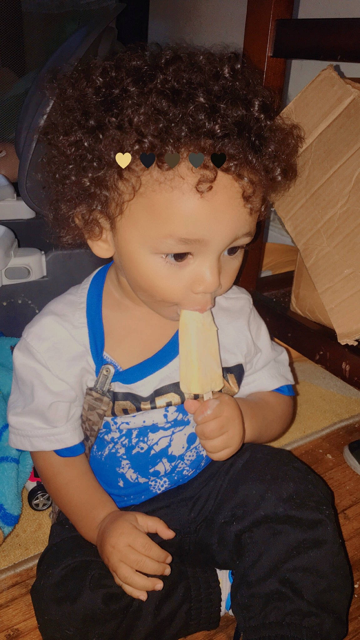 Elliot is registered to the contest to win money with this photo: afro, arm, baby_toddler_clothing, blue, chair, cheek, cool, eye, eyelash, finger, fun, hairstyle, head, iris, jheri_curl, lip, nose, organ, person, ringlet