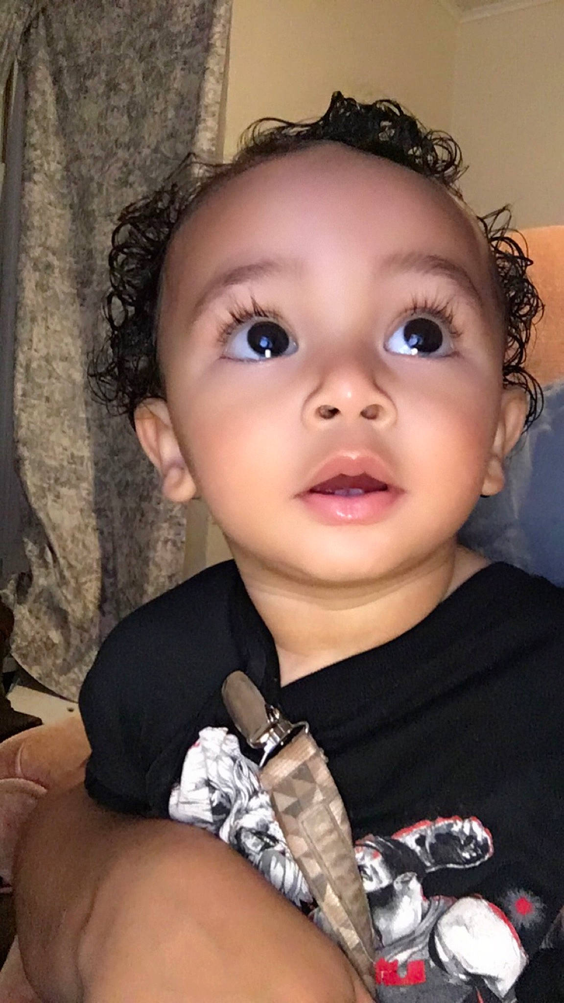 Elliot is registered to the contest to win money with this photo: baby, baby_toddler_clothing, black, cheek, child, chin, eyebrow, eyelash, face, flash_photography, fun, happy, head, human_body, iris, lip, mouth, nose, person, skin