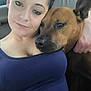 Princess is registered to the contest to win money with this photo: woman, dog, pet, face, portrait, snuggling, car_interior, affection, closeup, brown_dog, casual_clothing, relaxed, companion, human, animal, friendship, indoor, seat, love, togetherness