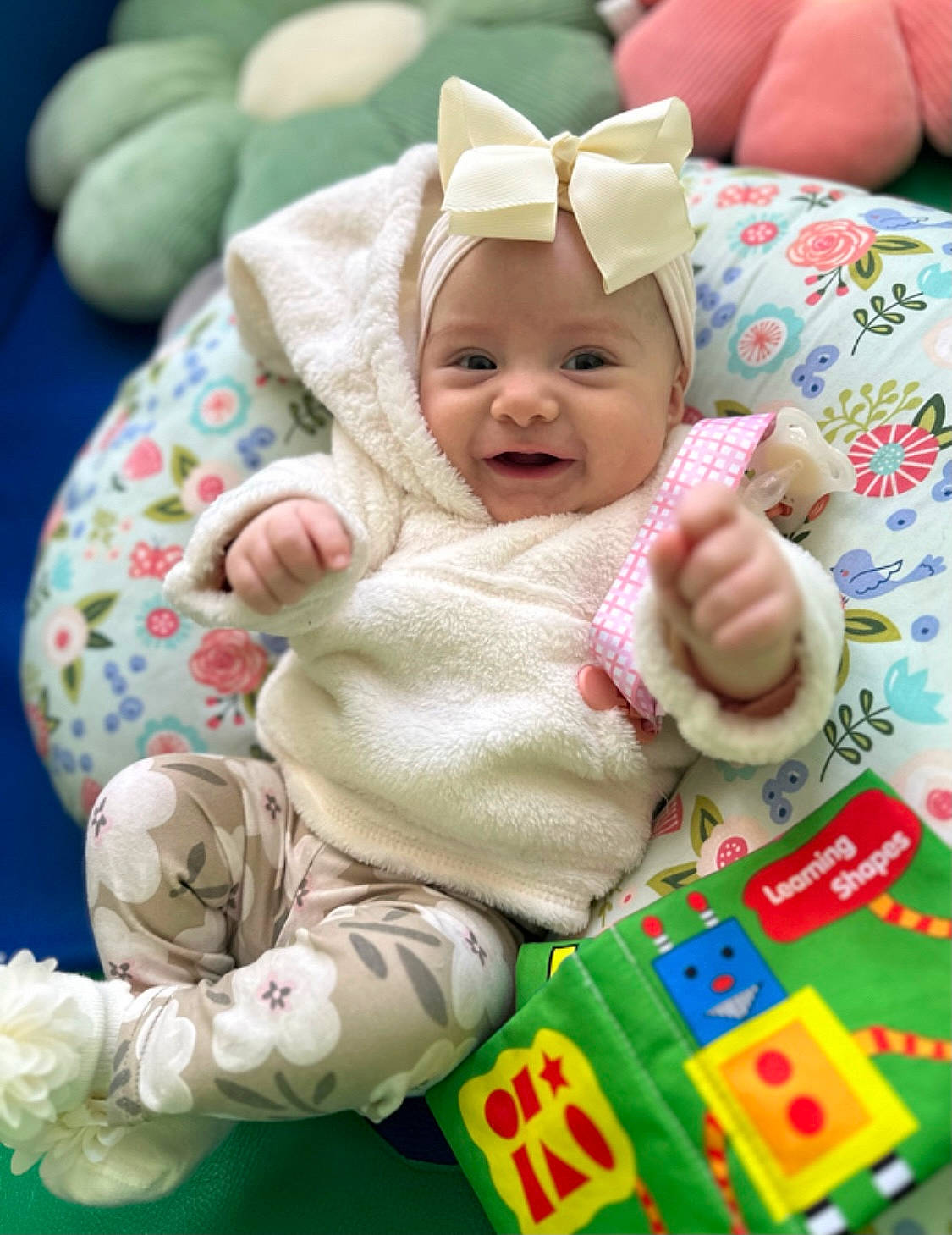 Sofia is registered to the contest to win money with this photo: baby, baby_products, baby_safety, baby_toddler_clothing, cheek, child, comfort, eye, face, fun, grass, green, happy, head, headwear, person, sitting, skin, sleeve, smile