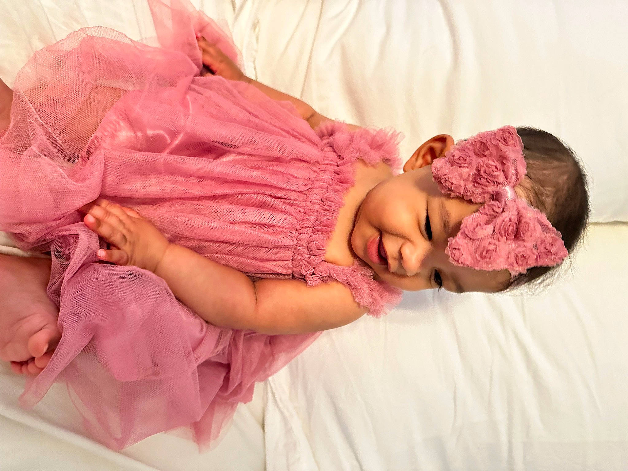 Sadie joined the competition — help win amazing prizes! baby_toddler_clothing, child, comfort, couch, dress, face, fashion_accessory, hand, happy, headpiece, headwear, human_body, linens, magenta, peach, person, pink, purple, skin, sleeve