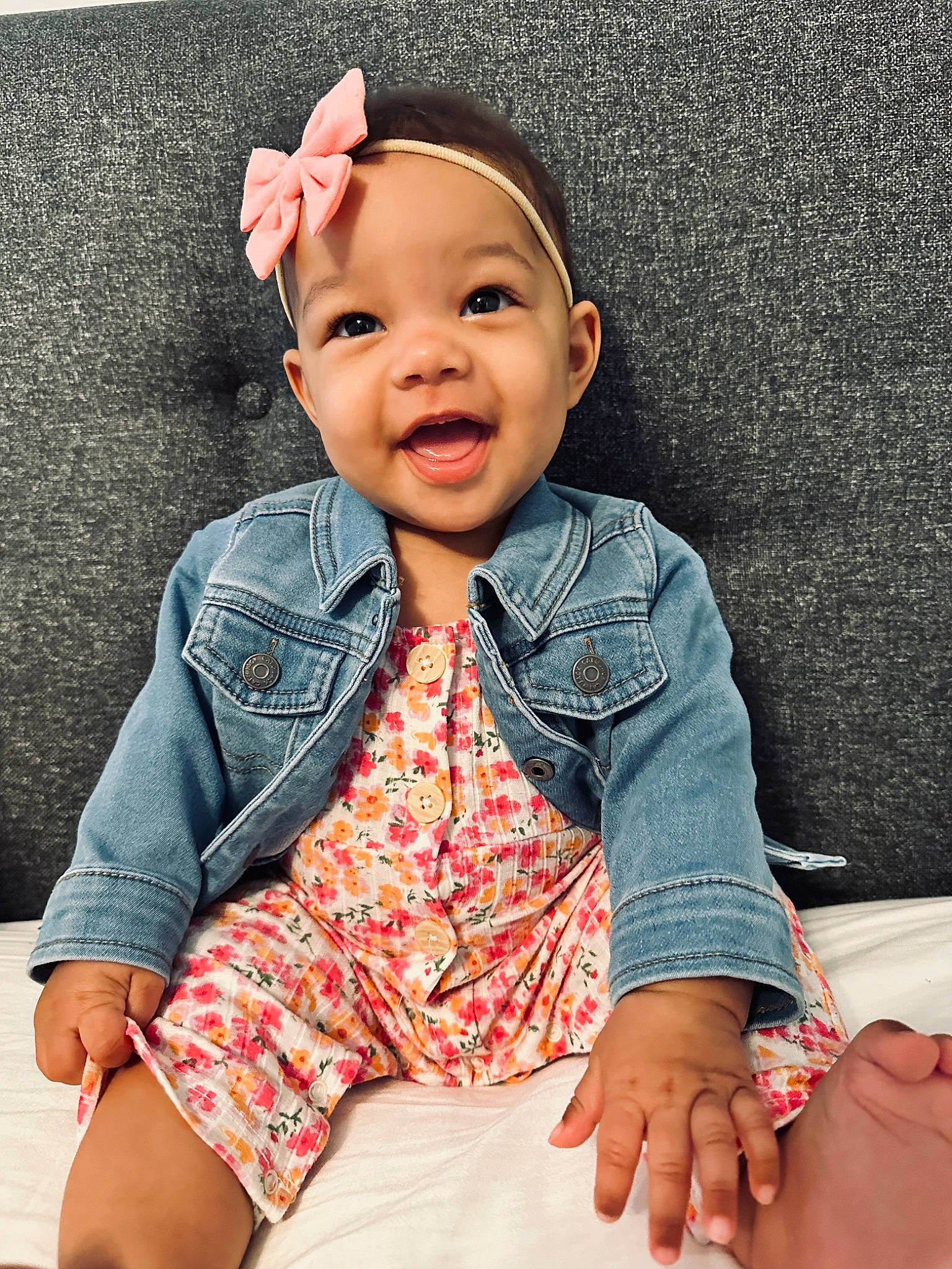 Sadie is registered to the contest to win money with this photo: baby_toddler_clothing, cheek, chin, collar, dress_shirt, face, facial_expression, finger, happy, lip, neck, nose, outerwear, person, pink, skin, sleeve, smile, standing, textile