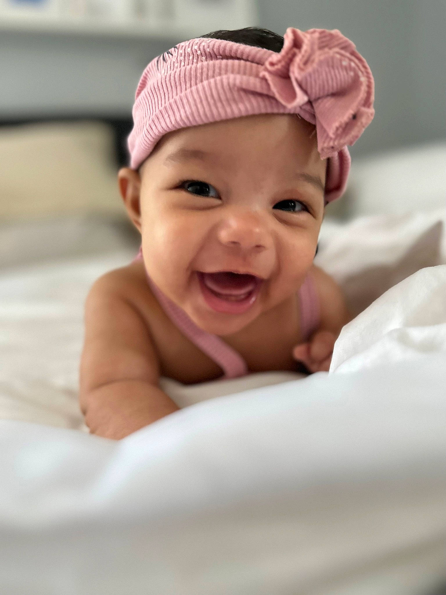 Sadie is registered to the contest to win money with this photo: baby, baby_laughing, baby_toddler_clothing, cap, cheek, comfort, fashion_accessory, flash_photography, flesh, fun, happy, headwear, laugh, linens, lip, magenta, person, portrait_photography, sleeve, smile