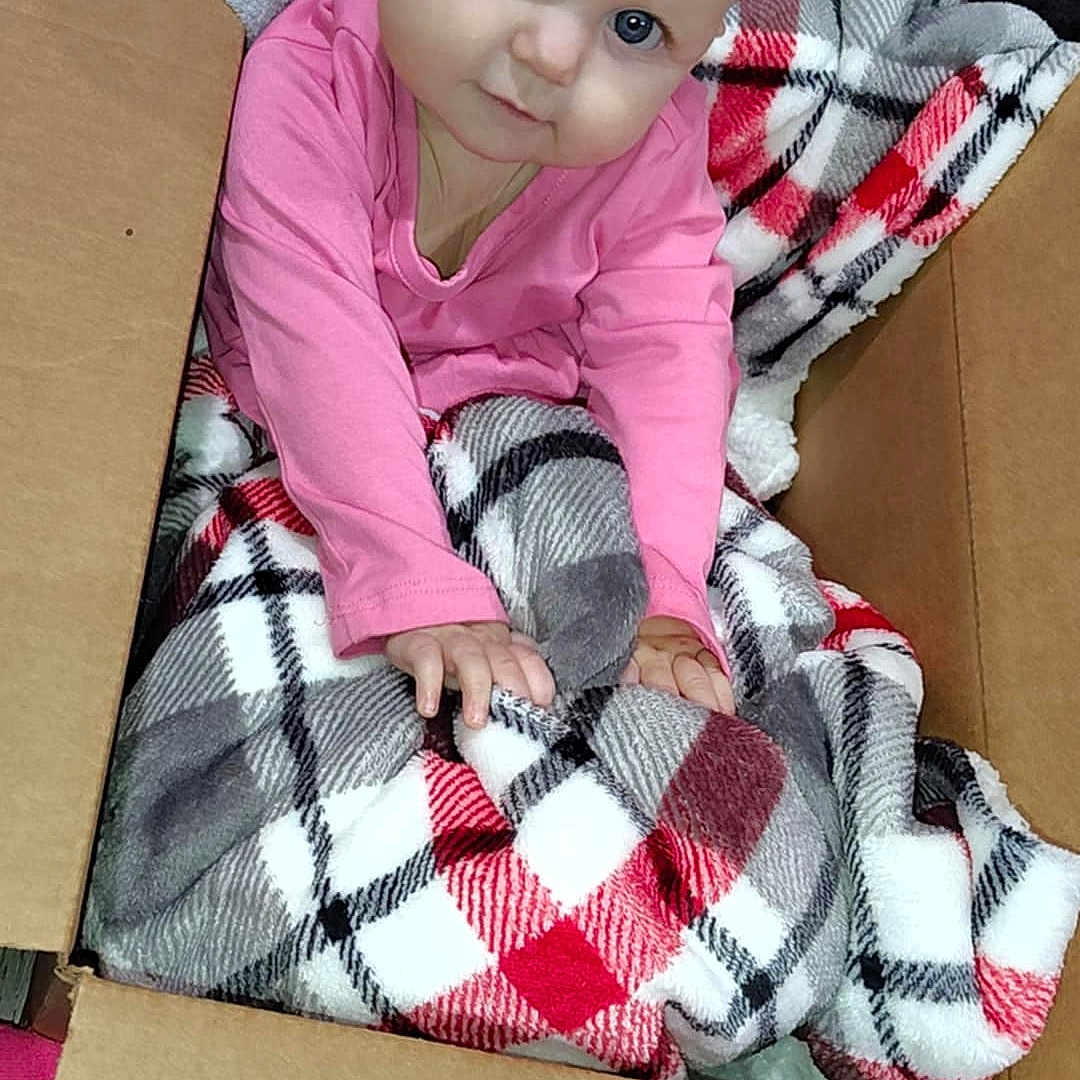 Veronica joined the competition — help win amazing prizes! baby, ball, blanket, box, clothing, cushion, dress, face, football, head, homedecor, newborn, pajamas, pants, person, photography, portrait, quilt, sitting, tartan