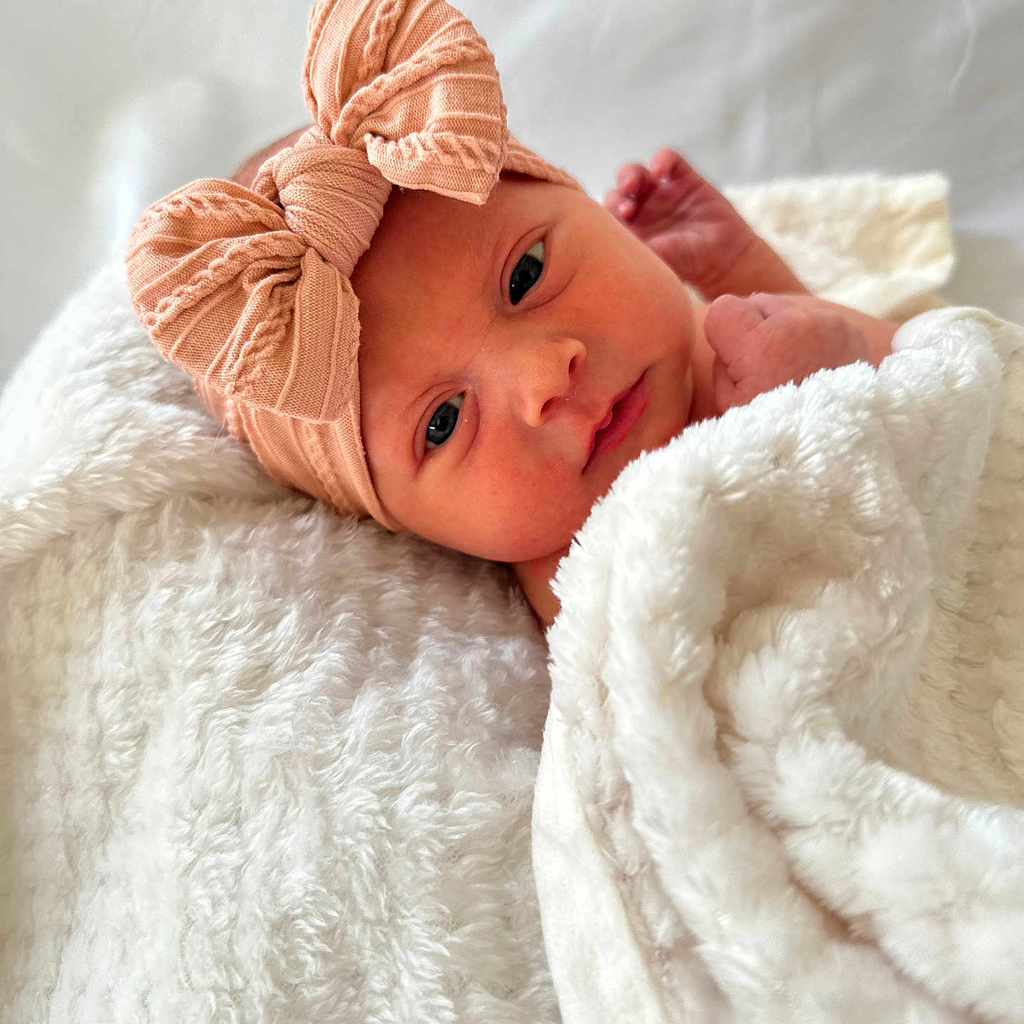 Ava joined the competition — help win amazing prizes! baby, bed, blanket, bonnet, cap, clothing, face, furniture, happy, hat, head, newborn, person, photography, portrait, quilt, smile, towel