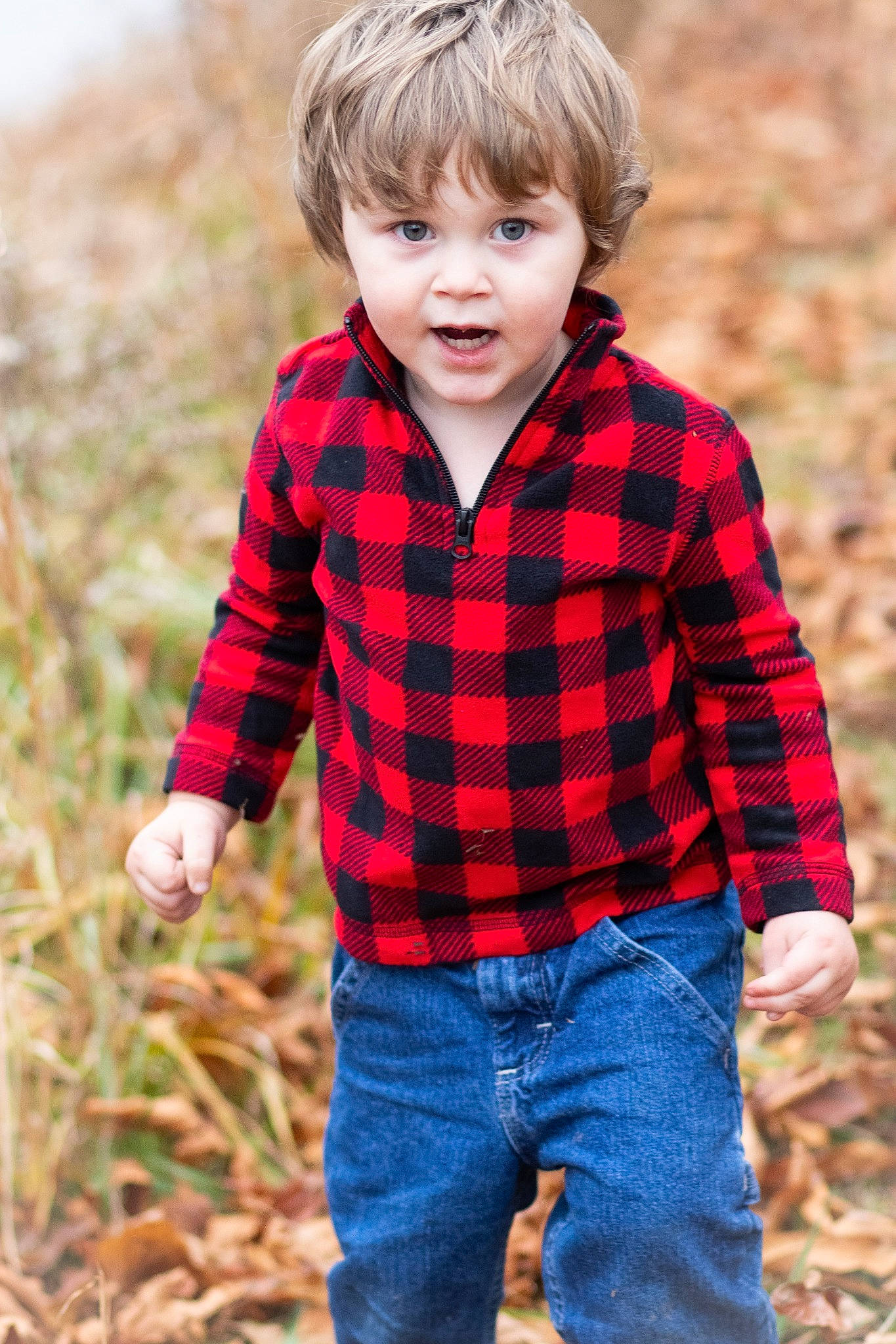 Virgil is registered to the contest to win money with this photo: child, child_model, design, grass, male, outerwear, pattern, people_in_nature, person, photography, plaid, plant, play, portrait, portrait_photography, sleeve, smile, tartan, toddler