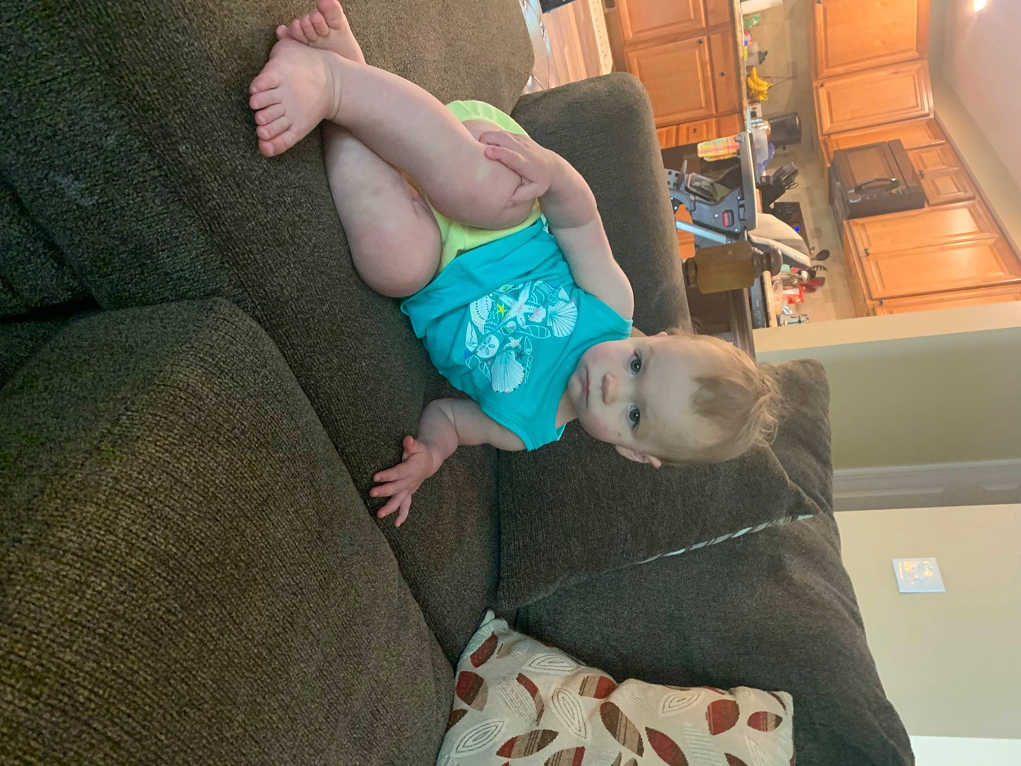 Capri is registered to the contest to win money with this photo: abdomen, canidae, child, companion_dog, couch, lap, leg, non_sporting_group, person, thigh