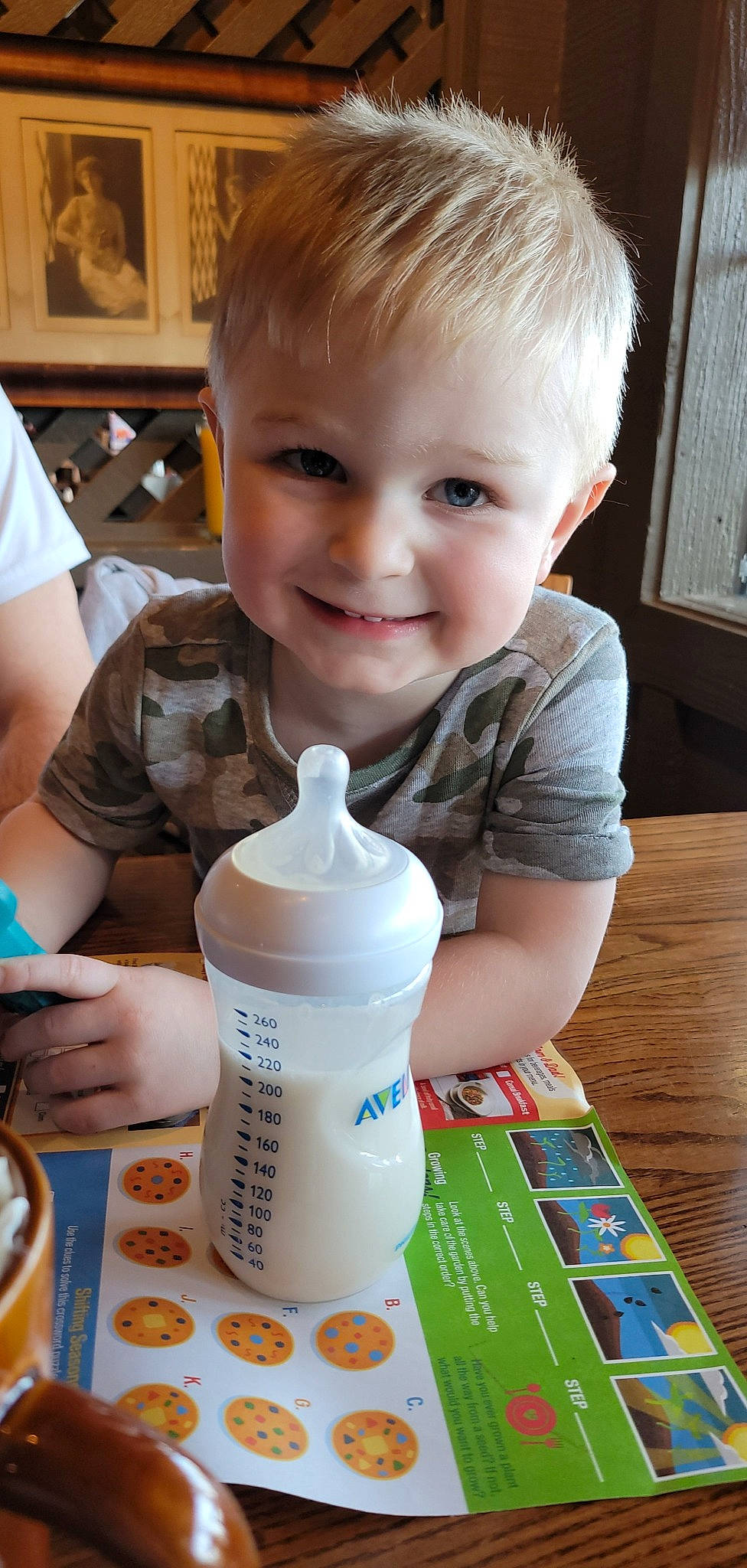 Bentley joined the competition — help win amazing prizes! bottle, cheek, child, drink, drinkware, finger, fluid, fun, joy, liquid, nail, person, photograph, plastic, plastic_bottle, play, skin, smile, t_shirt, table