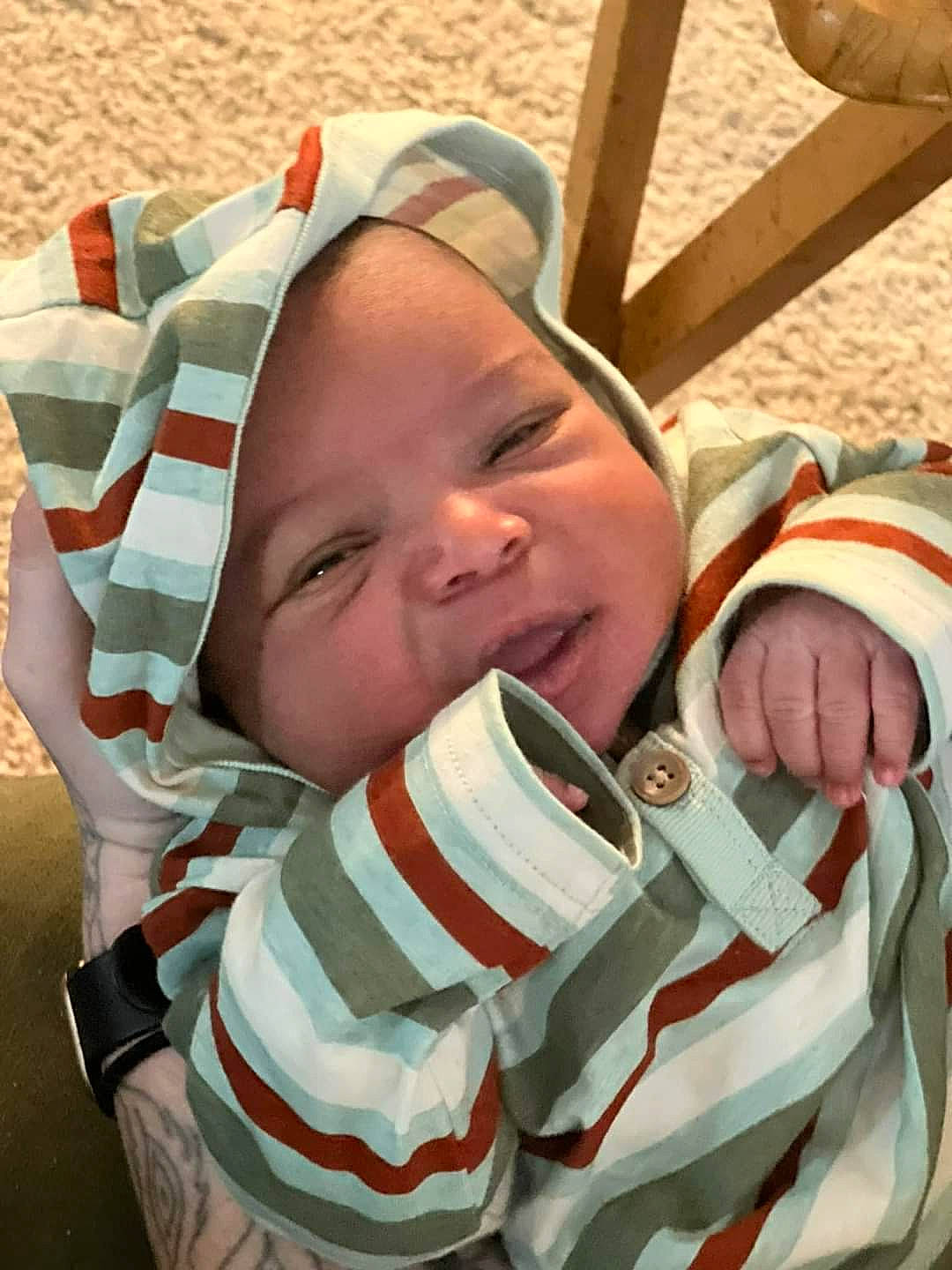 Supreme is registered to the contest to win money with this photo: baby, baby_products, baby_toddler_clothing, carmine, cheek, child, comfort, fashion_accessory, gesture, happy, headwear, lip, mouth, pattern, person, skin, sleeve, smile, textile, thumb