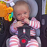 Elijah joined the competition — help win amazing prizes! baby, child, car_seat, toy, striped_clothing, infant, seatbelt, playful, cute, indoor, smiling, hand, face, blue_eyes, sitting, comfort, colorful, safety, young_child, clothing