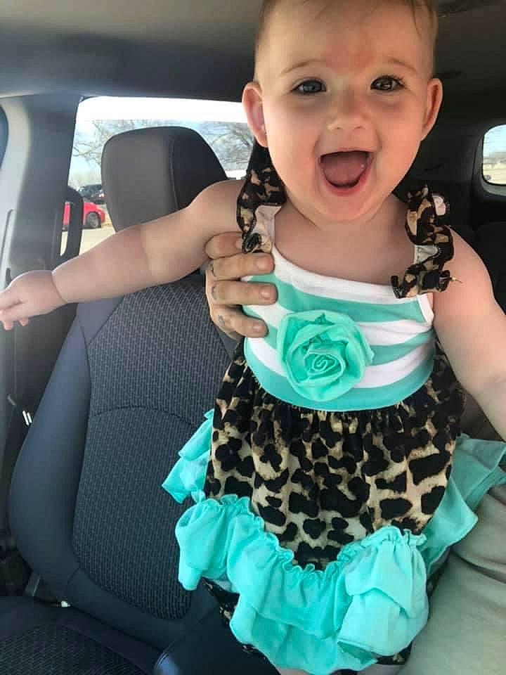 Lyllian joined the competition — help win amazing prizes! automotive_exterior, baby_toddler_clothing, child, day_dress, dress, face, hand, happy, head, neck, pattern, person, pink, shoulder, sleeve, t_shirt, thumb, toddler, trunk, vehicle_door