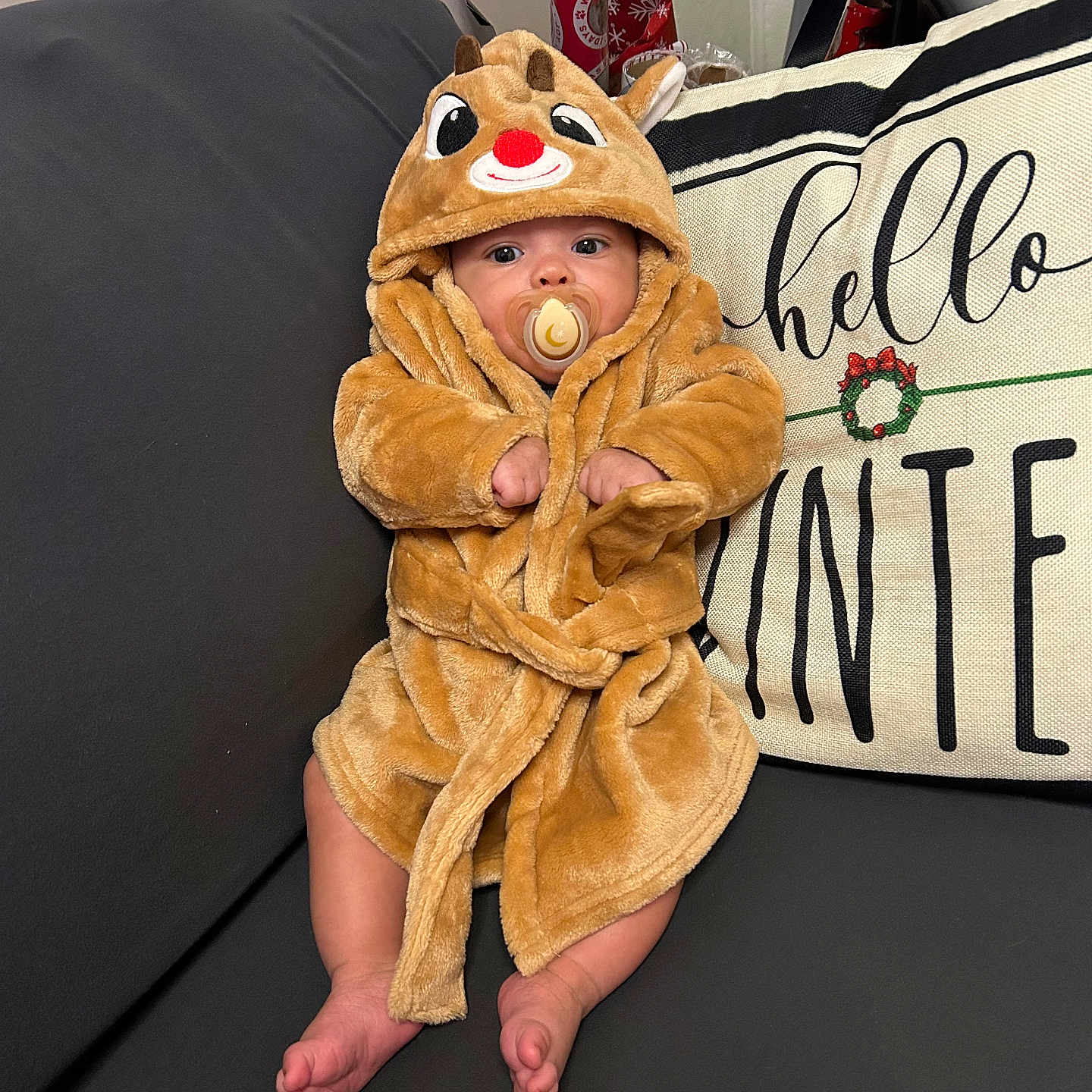 Saquan Jr joined the competition — help win amazing prizes! baby, blanket, bodypart, clothing, couch, cushion, face, fashion, finger, furniture, hand, hat, head, homedecor, hood, person, photography, portrait, robe, sitting