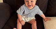 Jaxson joined the competition — help win amazing prizes! armchair, baby, blond, child, clothing, cute, face, foot, furniture, hand, happy, indoor, person, portrait, shorts, sitting, skin, smile, tshirt, young