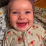 baby, blanket, bow, child, closeup, cozy, cute, face, happy, headwear, indoors, infant, pajamas, pattern, person, smiling, teeth, tongue, winnie_the_pooh, wood_floor