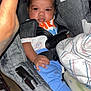 Tyriq is registered to the contest to win money with this photo: baby, car_seat, infant, child, clothing, blanket, bottle, face, hand, socks, safety_harness, fabric, seat, person, indoor, cute, newborn, resting, comfort, baby_bottle