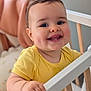 Victoire participe au concours pour gagner de l'argent avec cette photo : baby, child, smiling, yellow_clothing, crib, hand, dimples, face, happy, infant, indoors, nursery, wooden_rail, cute, soft_blanket, person, portrait, skin, young_child, cheerful