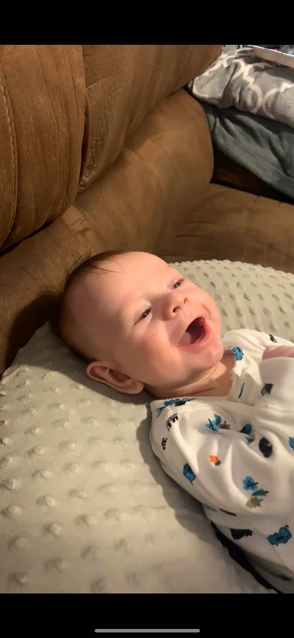 Keaton joined the competition — help win amazing prizes! baby, baby_toddler_clothing, bedtime, cheek, child, chin, comfort, flooring, linens, lip, mouth, nose, pattern, person, room, skin, sleeve, smile, toddler, white