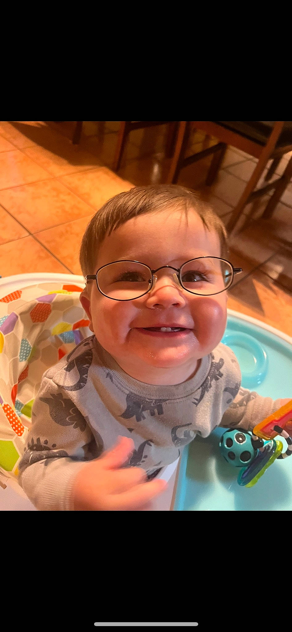 Mateo is registered to the contest to win money with this photo: animation, baby, child, eyewear, fun, glasses, happy, iris, jaw, joy, leisure, nose, person, personal_protective_equipment, play, recreation, selfie, sitting, smile, space