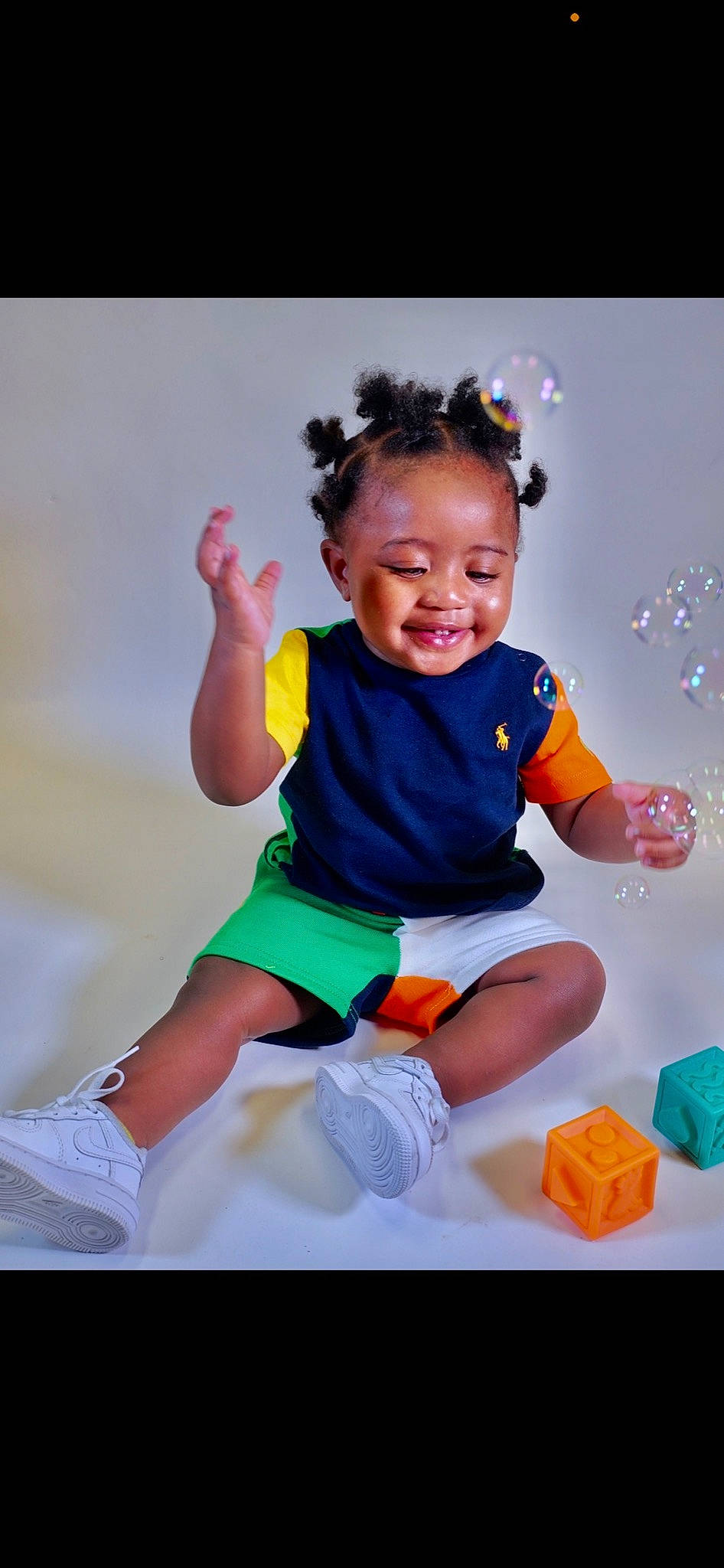 Kaidence is registered to the contest to win money with this photo: baby, baby_toddler_clothing, child, electric_blue, event, face, flash_photography, fun, happy, human_body, leisure, person, recreation, shorts, sitting, sleeve, smile, sock, t_shirt, thigh