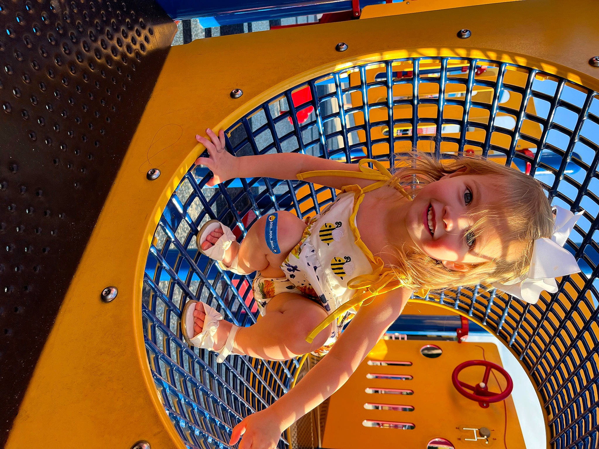 Cali is registered to the contest to win money with this photo: auto_part, automotive_design, automotive_tire, automotive_wheel_system, ceiling, electric_blue, engineering, eyewear, fun, happy, joy, leisure, machine, motor_vehicle, person, play, recreation, smile, t_shirt, tire