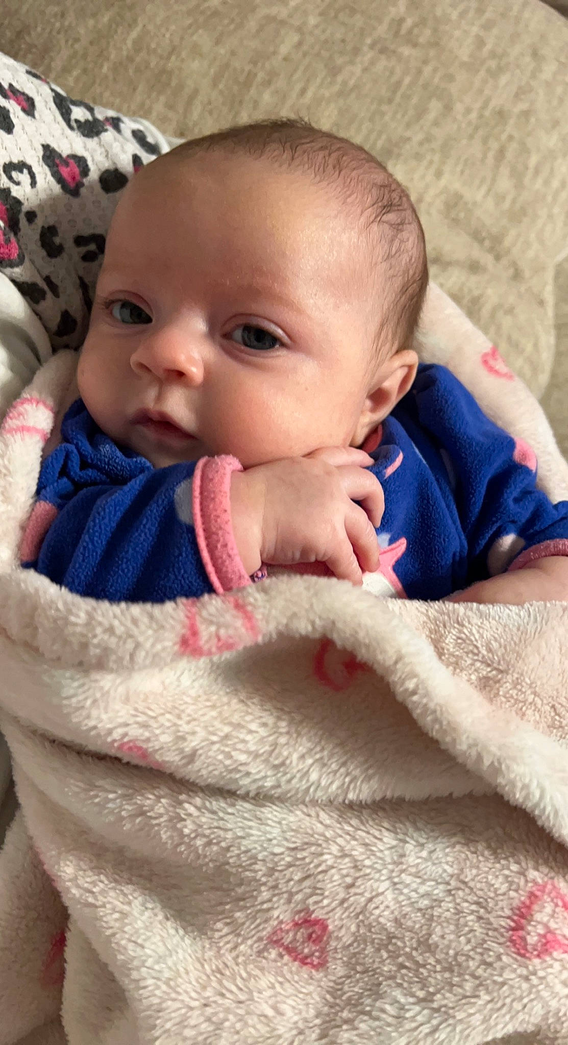 Emberlee is registered to the contest to win money with this photo: baby, baby_toddler_clothing, cheek, chin, comfort, eye, eyebrow, eyelash, finger, gesture, happy, head, iris, lip, mouth, nose, outerwear, person, skin, sleeve