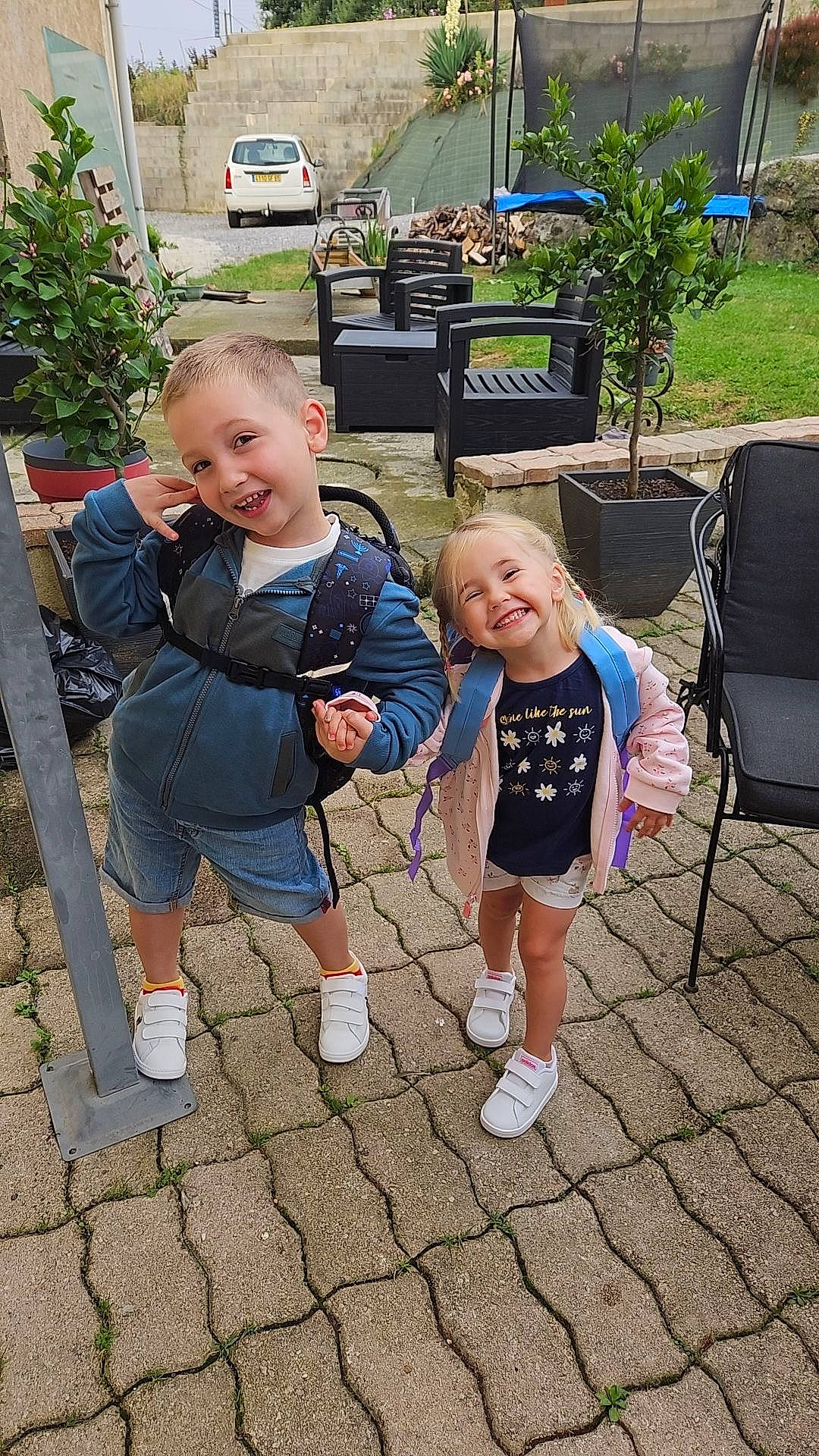 Margaux participe au concours pour gagner de l'argent avec cette photo : baby, chair, child, event, fun, garden, grass, joy, lawn, leisure, person, plant, recreation, shorts, sidewalk, sitting, smile, sneakers, t_shirt, toddler