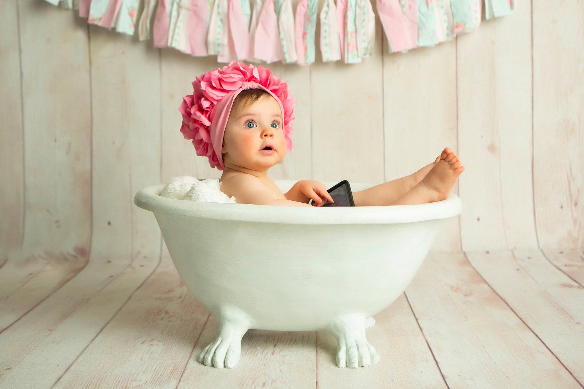 Claudia is registered to the contest to win money with this photo: baby, bathing, bathtub, child, person, pink, plumbing_fixture, room, surprise, toddler