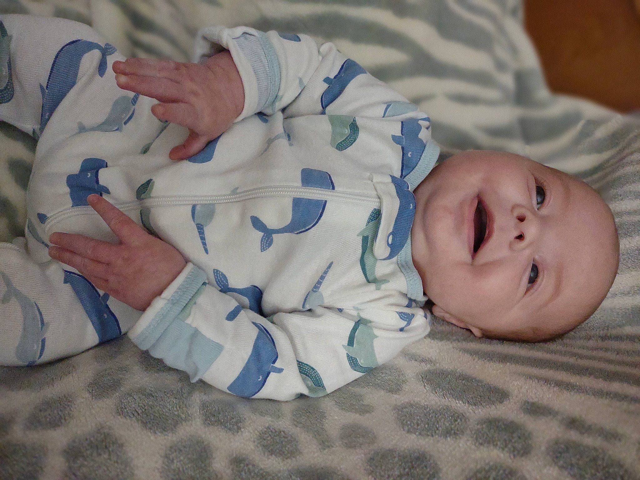 Christopher is registered to the contest to win money with this photo: baby, baby_toddler_clothing, child, comfort, face, finger, gesture, happy, mammal, nail, pattern, person, portrait_photography, room, sitting, skin, sleeve, smile, toddler, vertebrate