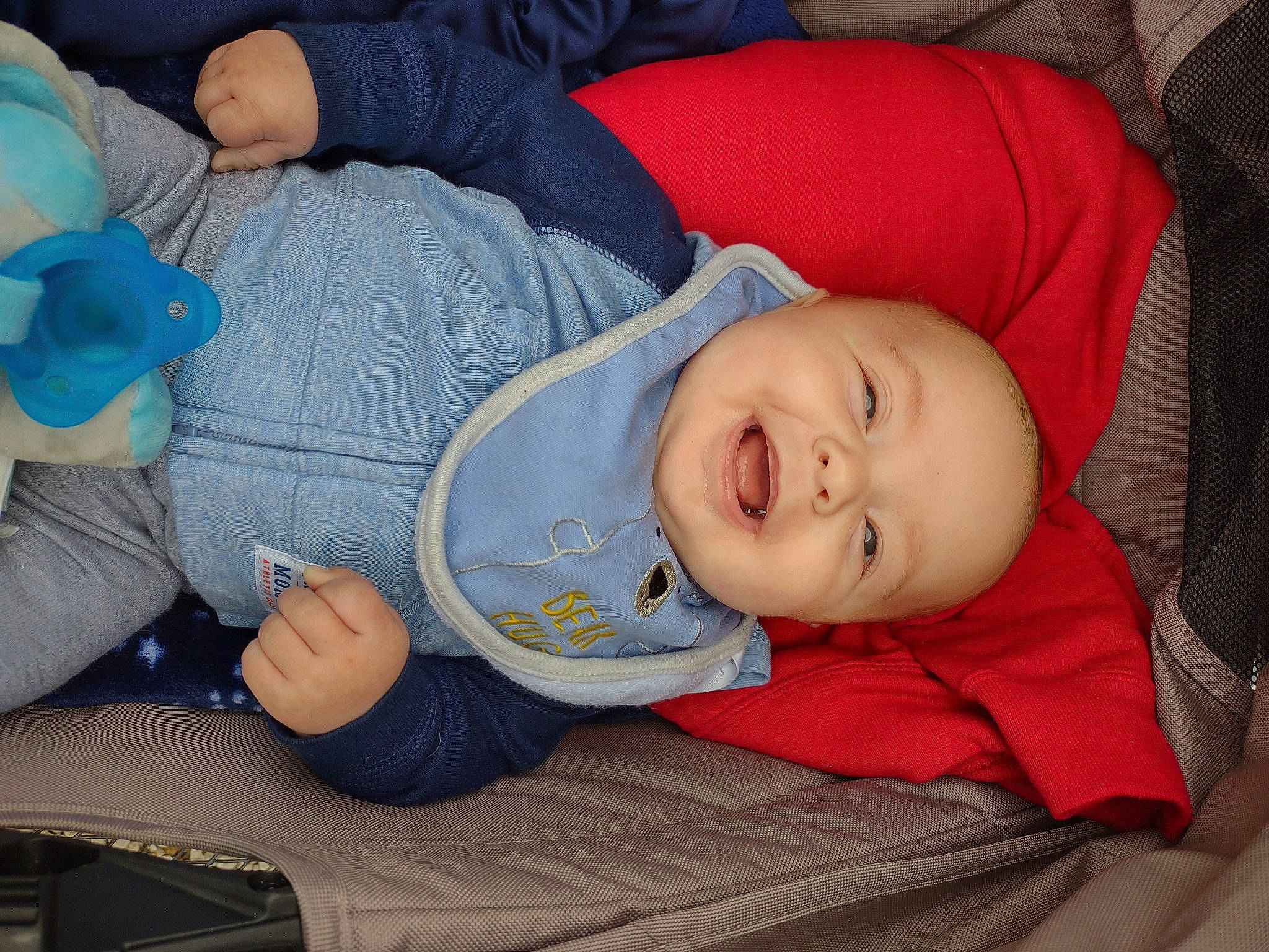 Christopher is registered to the contest to win money with this photo: baby, baby_products, baby_toddler_clothing, blue, carmine, cheek, child, comfort, electric_blue, face, hat, head, human_body, lap, person, product, sitting, sleep, sleeve, smile