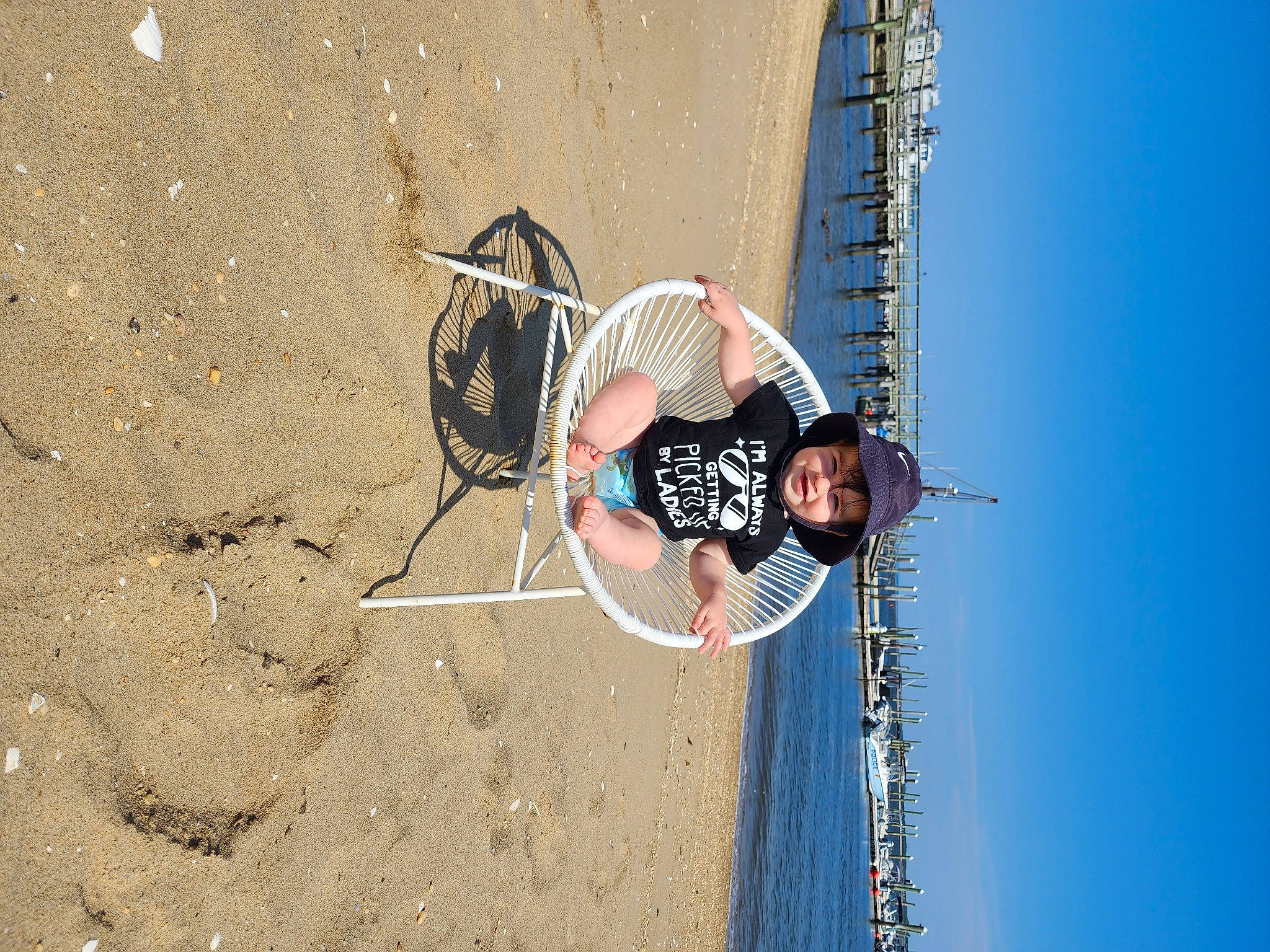 Albert is registered to the contest to win money with this photo: adventure, beach, bicycle_tire, competition_event, elbow, extreme_sport, fun, headwear, leisure, net, person, racket, recreation, sand, sky, soil, sport_climbing, sports, sports_equipment, sports_uniform