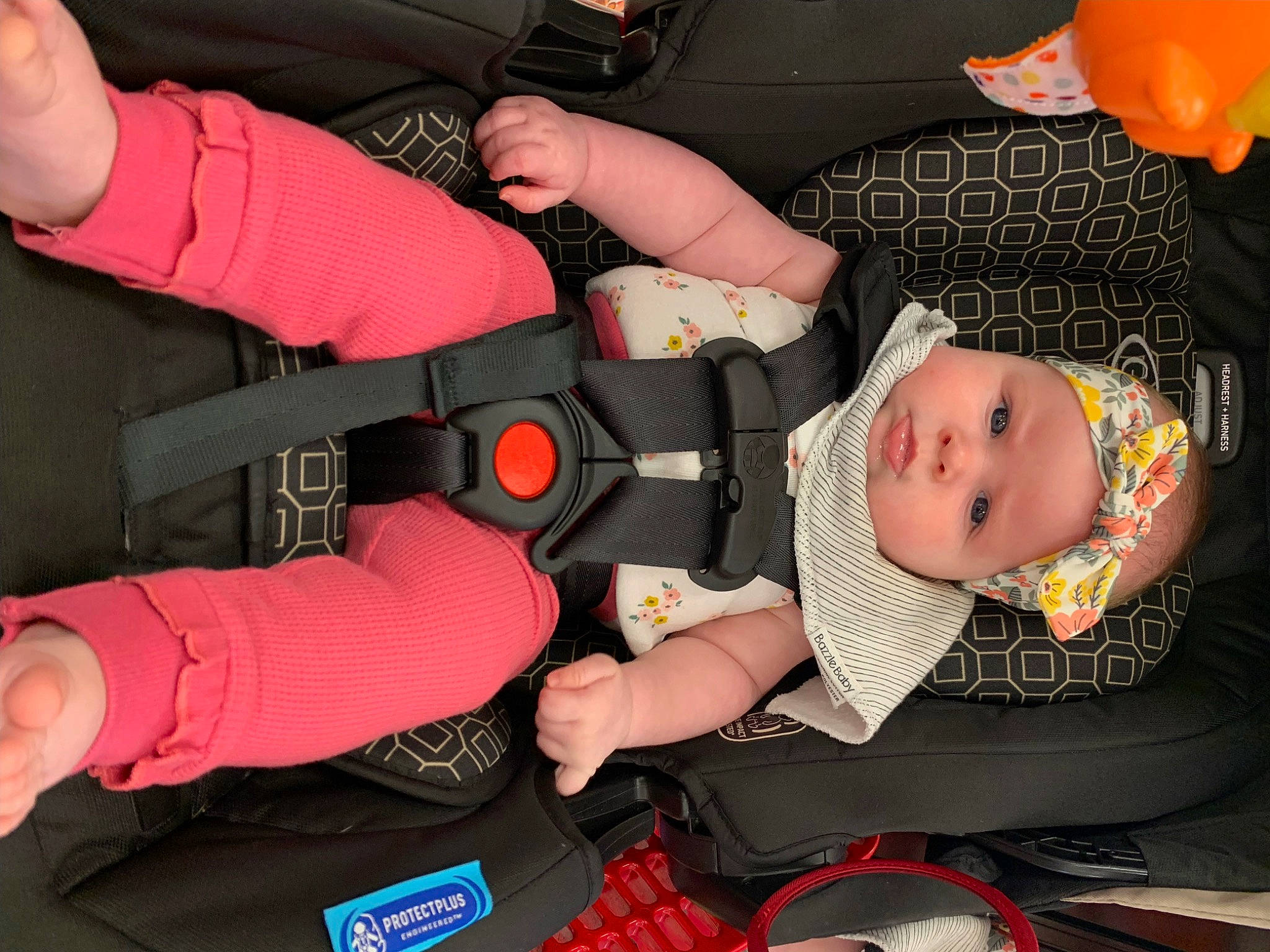 Rae joined the competition — help win amazing prizes! arm, auto_part, baby, baby_carriage, baby_products, baby_toddler_clothing, balloon, car_seat, carmine, child, comfort, fun, hand, headwear, lap, nail, person, personal_protective_equipment, red, sitting