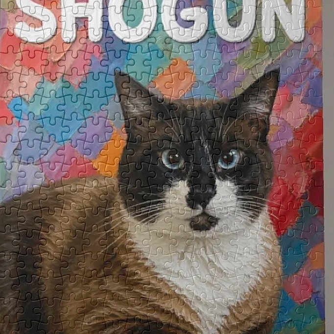 Shogun is registered to the contest to win money with this photo: cat, siamese_cat, puzzle, jigsaw_puzzle, colorful, blue_eyes, animal, pet, feline, lying_down, multicolor_background, text_overlay, word_shogun, whiskers, fur, close_up, portrait, indoor, artistic, pattern