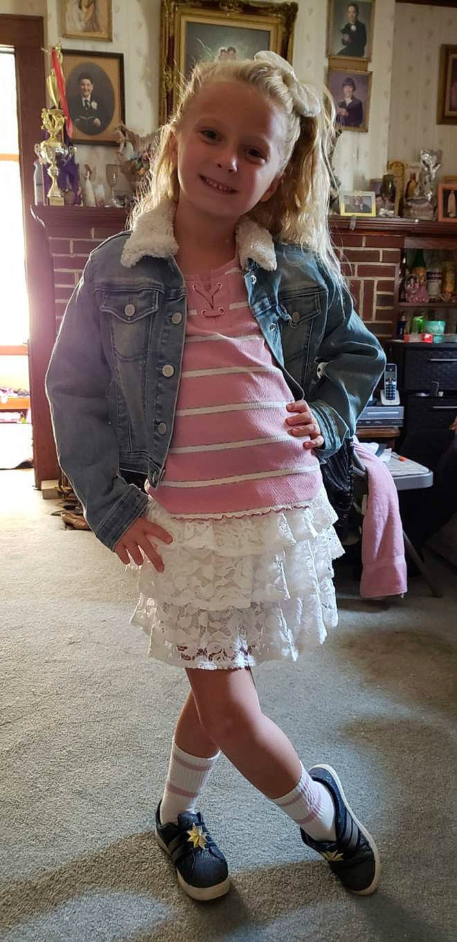 Angela is registered to the contest to win money with this photo: beige, blond, child_model, clothing, dress, fashion, footwear, hair_coloring, jacket, joy, lady, leather, leather_jacket, leg, long_hair, outerwear, person, pink, shoe, snapshot