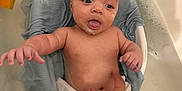 Grayson is registered to the contest to win money with this photo: baby, bath, bathtub, water, foam, towel, hand, skin, infant, child, cute, smile, face, relaxation, home, care, clean, comfort, nurture, person