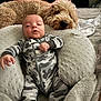 Grayson joined the competition — help win amazing prizes! baby, infant, dog, puppy, camouflage, pajamas, pillow, bed, blanket, fur, pet, sleeping, resting, cozy, cute, indoor, person, animal, face, comfort