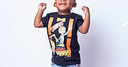 Semaj joined the competition — help win amazing prizes! black_shoes, black_tshirt, casual_clothing, child, cute, denim_shorts, fashion, fun, happy, joyful, orange_socks, person, portrait, short_hair, smiling, standing, studio, toddler, victory_pose, white_background