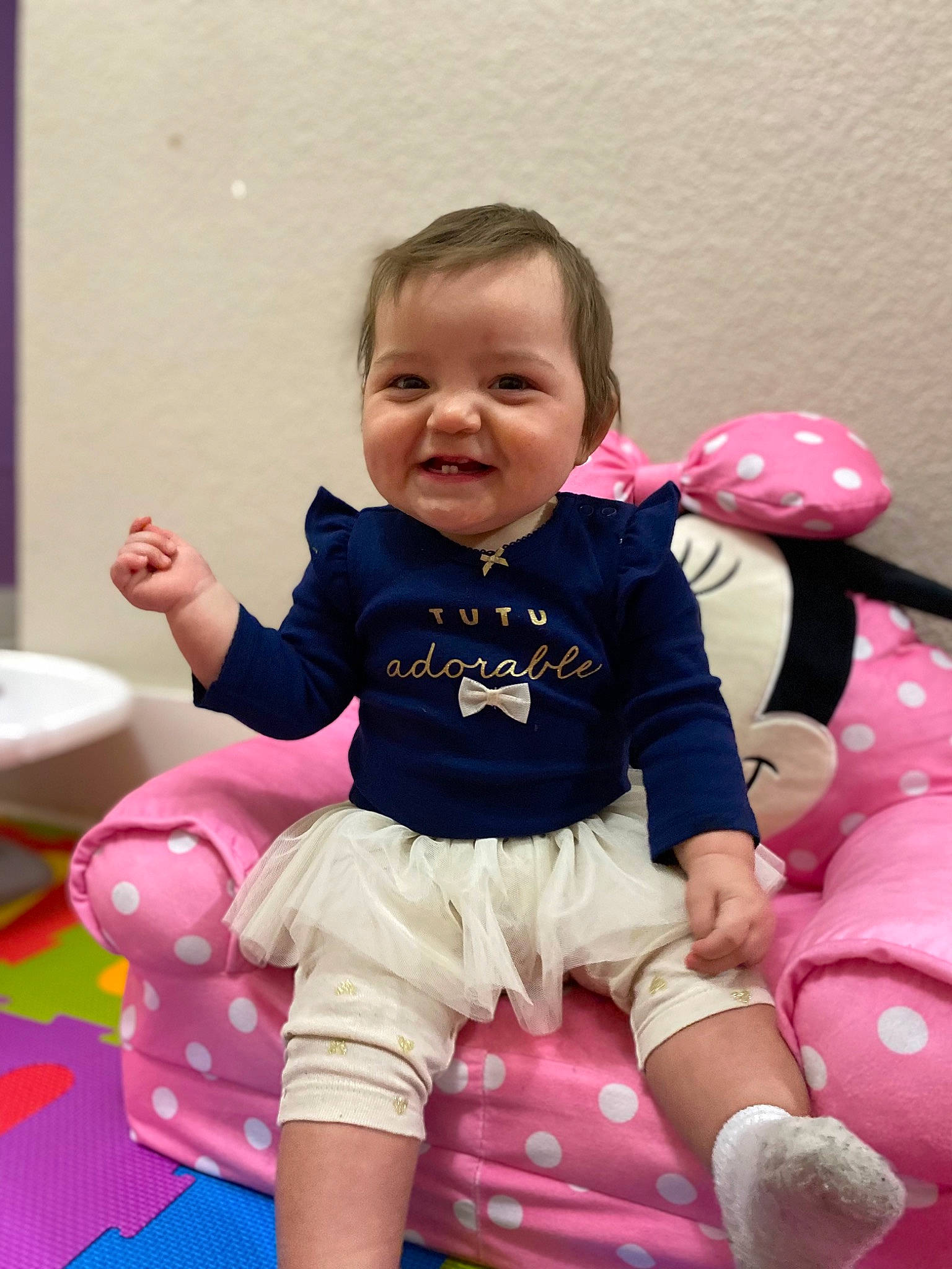 Mackenzie is registered to the contest to win money with this photo: baby, baby_playing_with_toys, baby_products, baby_toddler_clothing, cheek, child, fun, happy, joy, leg, magenta, person, pink, purple, sitting, skin, sleeve, smile, sock, t_shirt
