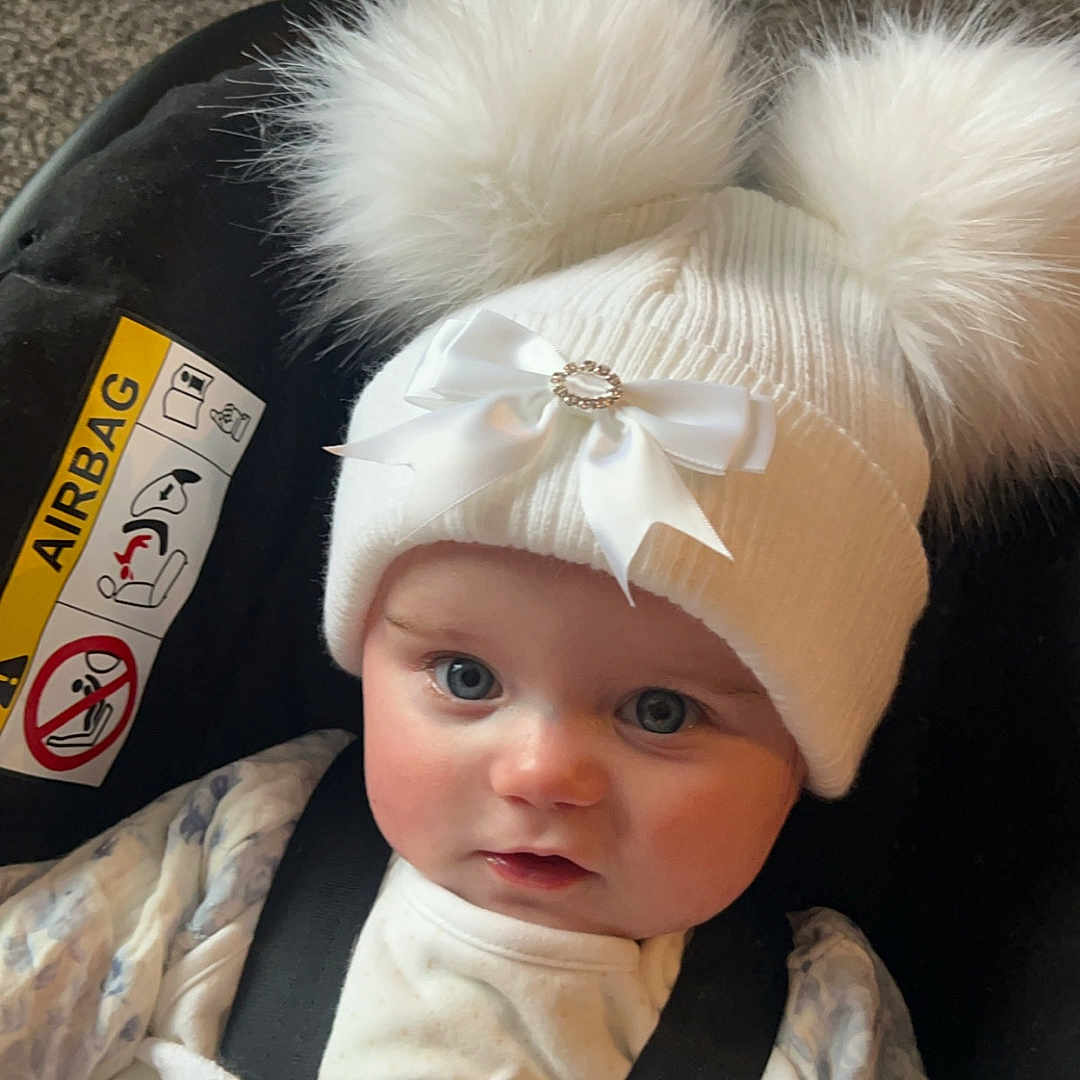 Brooke is registered to the contest to win money with this photo: accessories, baby, belt, bonnet, cap, clothing, costume, cushion, face, fur, glove, hat, head, homedecor, newborn, person, photography, portrait, strap, toy