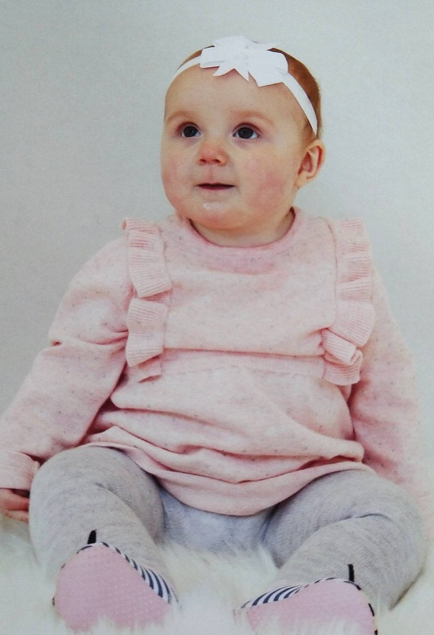 Isabell is registered to the contest to win money with this photo: baby, baby_toddler_clothing, cheek, child, face, facial_expression, head, headgear, lip, person, pink, portrait, skin, sleeve, smile, toddler